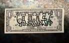 Dessin de Keith Haring sur billet de 1 dollar 1985
